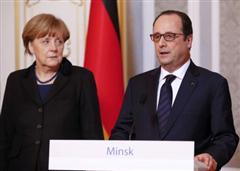 Hollande et Merkel lors d'un point de presse à Minsk (Photo Reuters). 