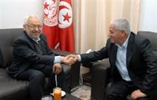 Poignée de main Ghannouchi/ Abassi. 